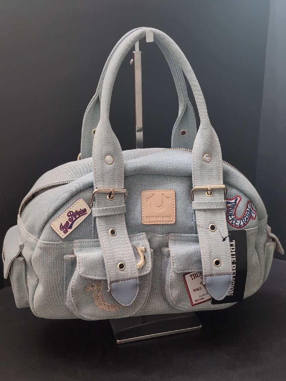 NWT,True Religion Light Wash Denim Satchel with Multi-patch Details.